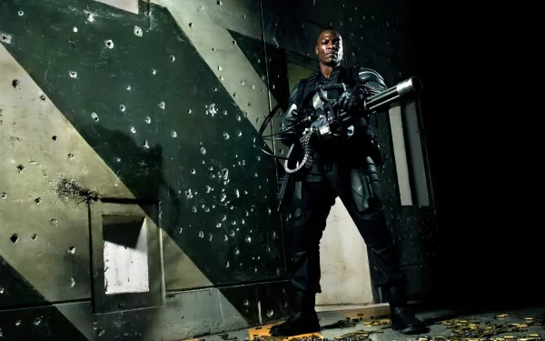 HD PC desktop wallpaper featuring a scene from the movie G.I. Joe: The Rise of Cobra with a character holding a large weapon against a bullet-ridden wall backdrop.
