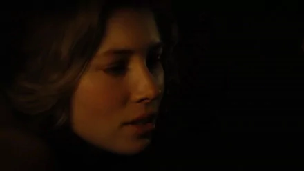 HD desktop wallpaper featuring a close-up portrait of celebrity Jessica Biel with a dark, moody background.