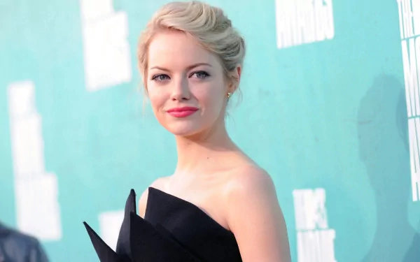 HD desktop wallpaper of celebrity Emma Stone, featuring her in an elegant black dress against a turquoise backdrop.
