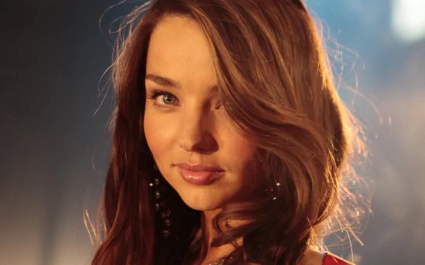 A stunning HD background featuring celebrity Miranda Kerr, showcasing her captivating beauty and elegant style in a charming portrait.