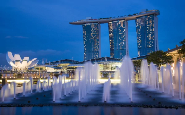 HD desktop wallpaper featuring the iconic Marina Bay Sands in Singapore with illuminated fountains and city lights against a twilight sky.