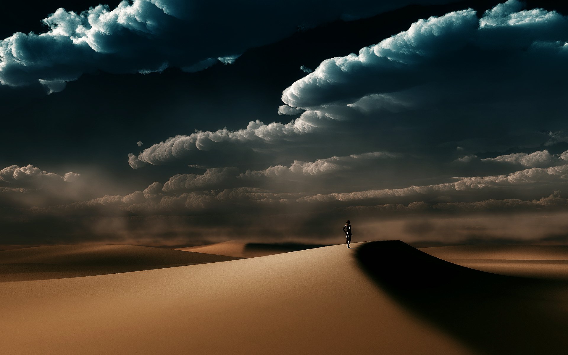 HD PC desktop wallpaper featuring a dramatic fantasy landscape with vast sand dunes under a moody, cloud-filled sky.
