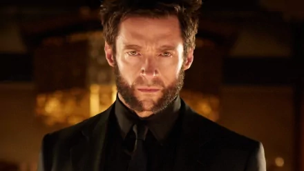 Logan James Howlett, portrayed by Hugh Jackman, stands poised and intense in this HD wallpaper from The Wolverine, showcasing his iconic character's fierce demeanor.