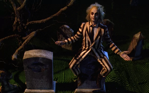 HD PC desktop wallpaper featuring Michael Keaton as Beetlejuice in his iconic striped suit, set in a dark, eerie graveyard scene from the movie Beetlejuice.