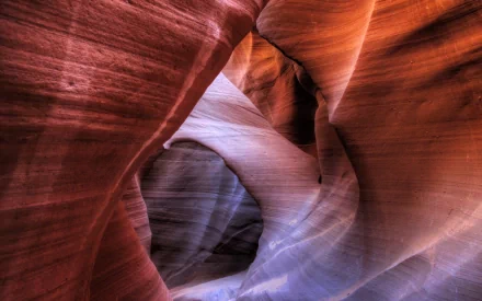 HD PC desktop wallpaper showcasing the smooth, flowing sandstone formations and warm natural light inside Antelope Canyon.