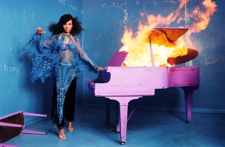 HD PC desktop wallpaper featuring Alicia Keys standing beside a flaming pink grand piano, blending music and striking visual art.