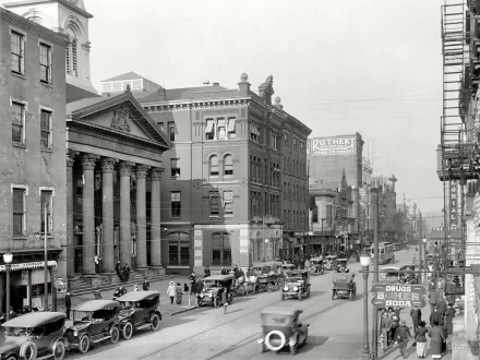 Black-and-white historic Harrisburg street scene with early automobiles, brick buildings and columned courthouse — man-made urban panorama, 2K Quad HD PC desktop wallpaper background.