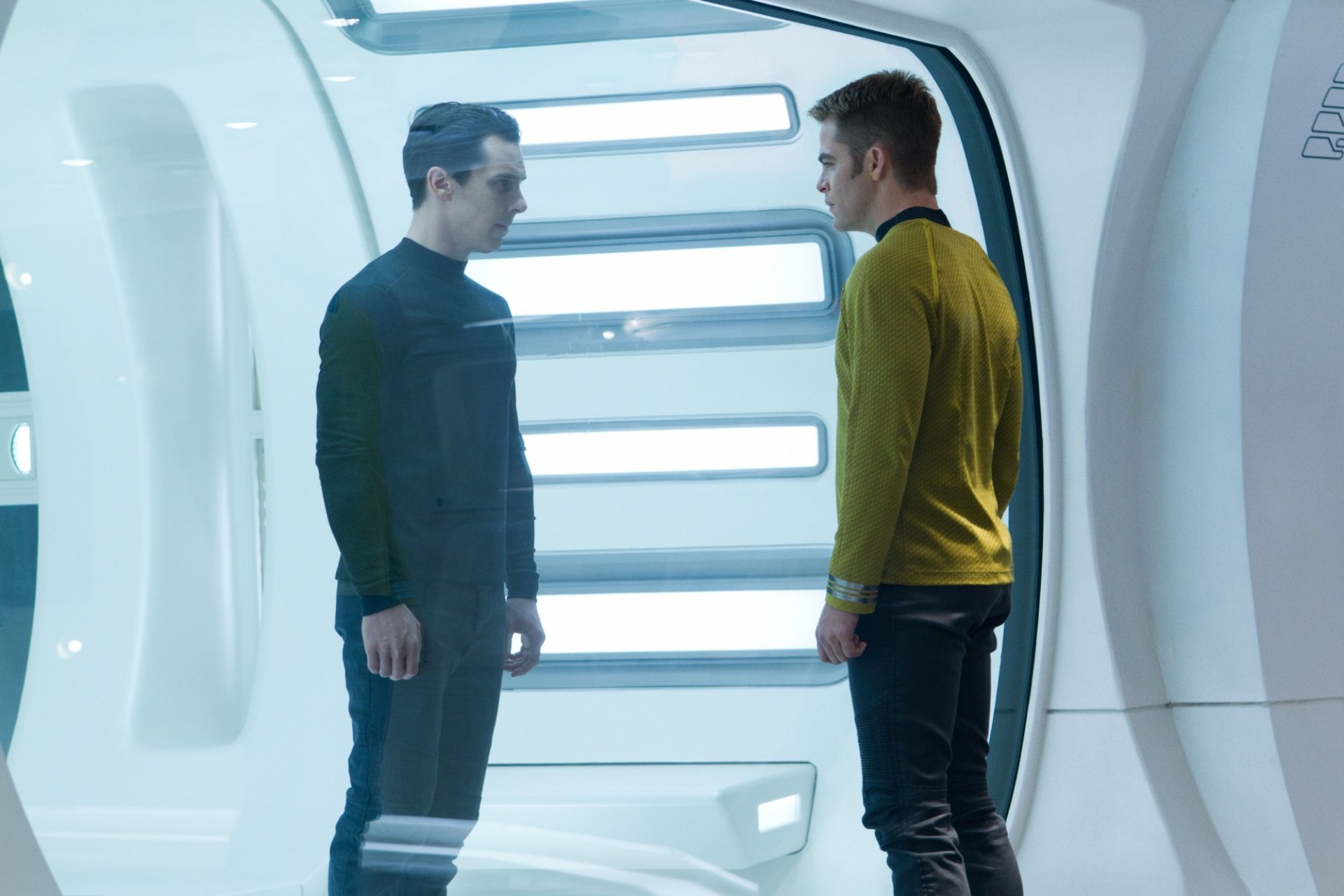 HD PC desktop wallpaper from the movie Star Trek Into Darkness, featuring two characters facing each other in a futuristic white corridor.