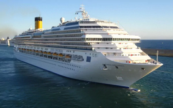 HD PC desktop wallpaper of the Costa Concordia cruise ship sailing on clear blue waters under a bright sky.