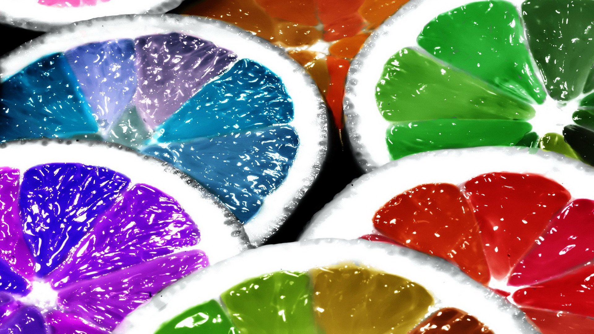 HD PC desktop wallpaper featuring colorful lemon slices in vibrant shades of blue, green, purple, red, and orange with a glossy, fresh texture.