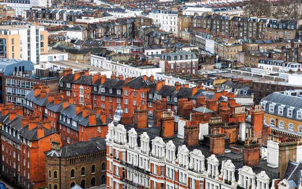 HD PC desktop wallpaper showcasing a densely packed man-made town with rows of brick buildings and rooftops extending into the distance.