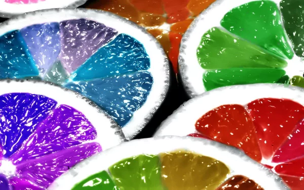 HD PC desktop wallpaper featuring colorful lemon slices in vibrant shades of blue, green, purple, red, and orange with a glossy, fresh texture.