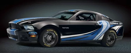 A sleek Ford Mustang Cobra Jet twin-turbo, prominently displayed in a dynamic black and blue design, serves as a stunning HD PC desktop wallpaper and background.