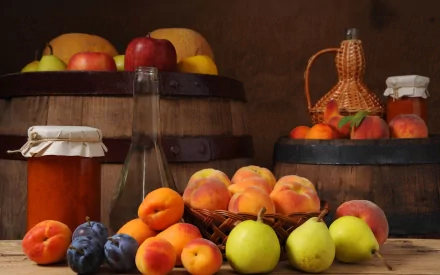 HD PC desktop wallpaper featuring an arrangement of fresh fruit and jars, set against rustic wooden barrels and a warm, earthy background.