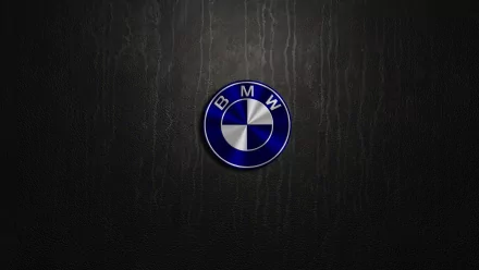 A sleek HD desktop wallpaper featuring the iconic BMW logo against a textured black background, embodying luxury and performance in automotive design.
