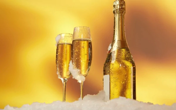 Elegant champagne bottle with two filled glasses, set against a warm golden background, creating a luxurious atmosphere for a drink and food-themed HD desktop wallpaper.