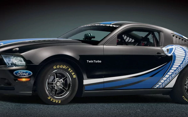 A sleek Ford Mustang Cobra Jet twin-turbo, prominently displayed in a dynamic black and blue design, serves as a stunning HD PC desktop wallpaper and background.