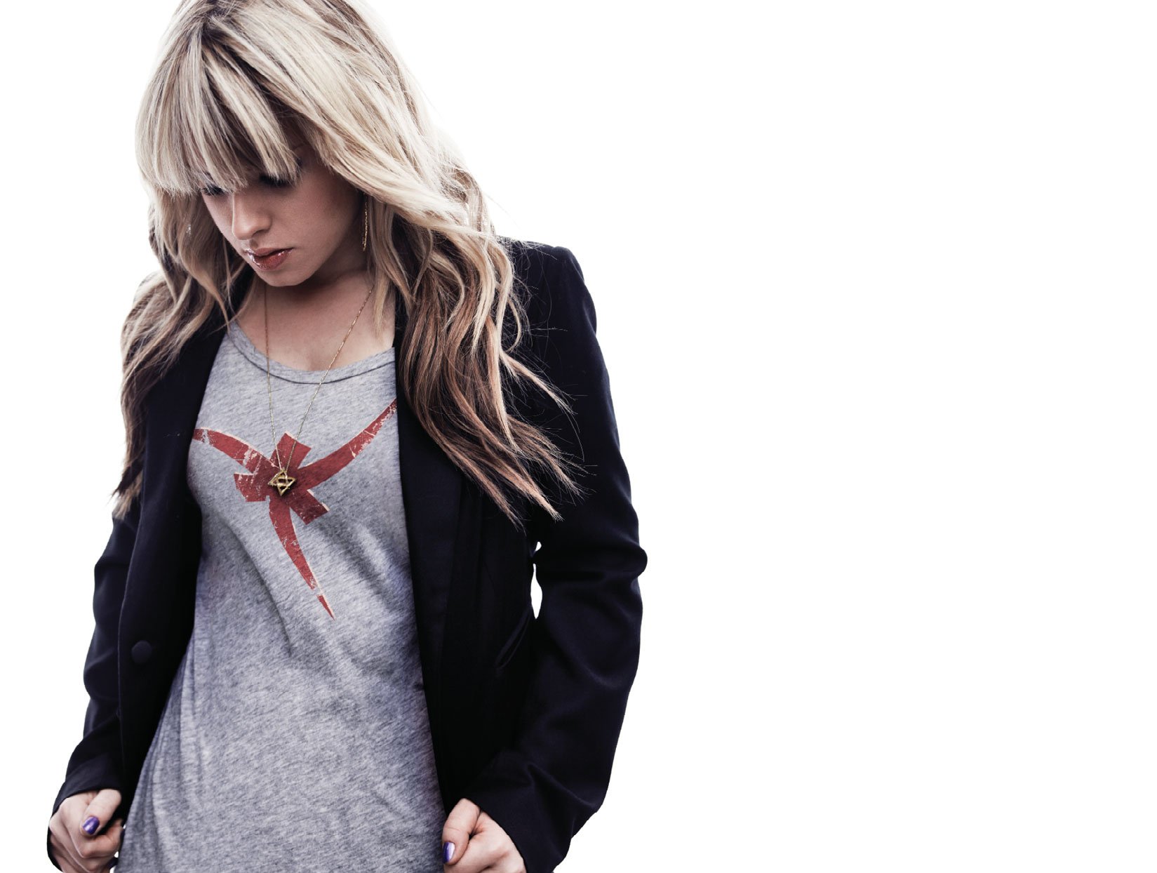 HD PC desktop wallpaper featuring Orianthi in a casual outfit, blending music and style with a clean, minimalist background.