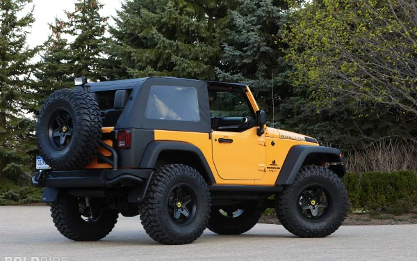 HD PC desktop wallpaper featuring a vibrant yellow Jeep Wrangler Traildozer parked outdoors against a backdrop of lush green trees.