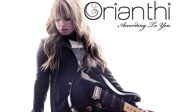 HD desktop wallpaper featuring music artist Orianthi with her guitar, styled in a modern and striking pose against a clean white background.
