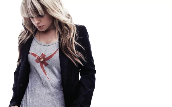 HD PC desktop wallpaper featuring Orianthi in a casual outfit, blending music and style with a clean, minimalist background.