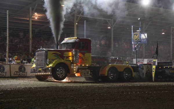 4K Ultra HD PC desktop wallpaper and background of a painted Peterbilt truck in an indoor truck pull, exhaust plumes rising under arena lights.