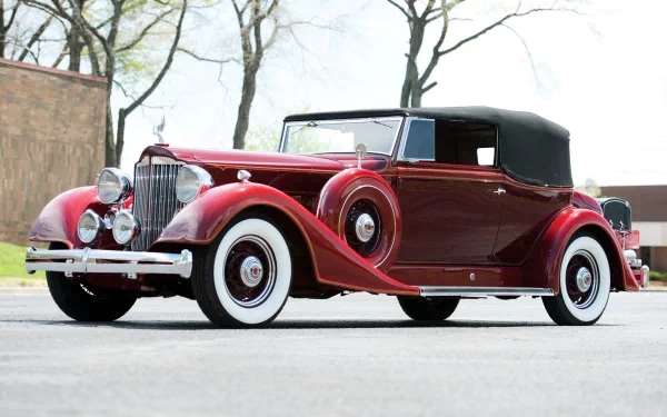 Vintage red Packard Eight convertible with whitewall tires parked outdoors, captured in high definition for a classic car desktop wallpaper.