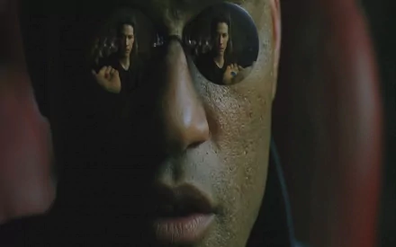 HD PC desktop wallpaper featuring a close-up of Morpheus from The Matrix, with his iconic reflective sunglasses showing Neo reaching out.