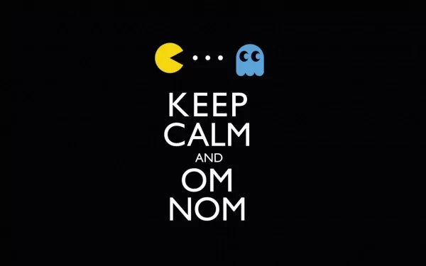 HD PC desktop wallpaper featuring a funny Keep Calm and Om Nom message with Pac-Man and a ghost on a black background.