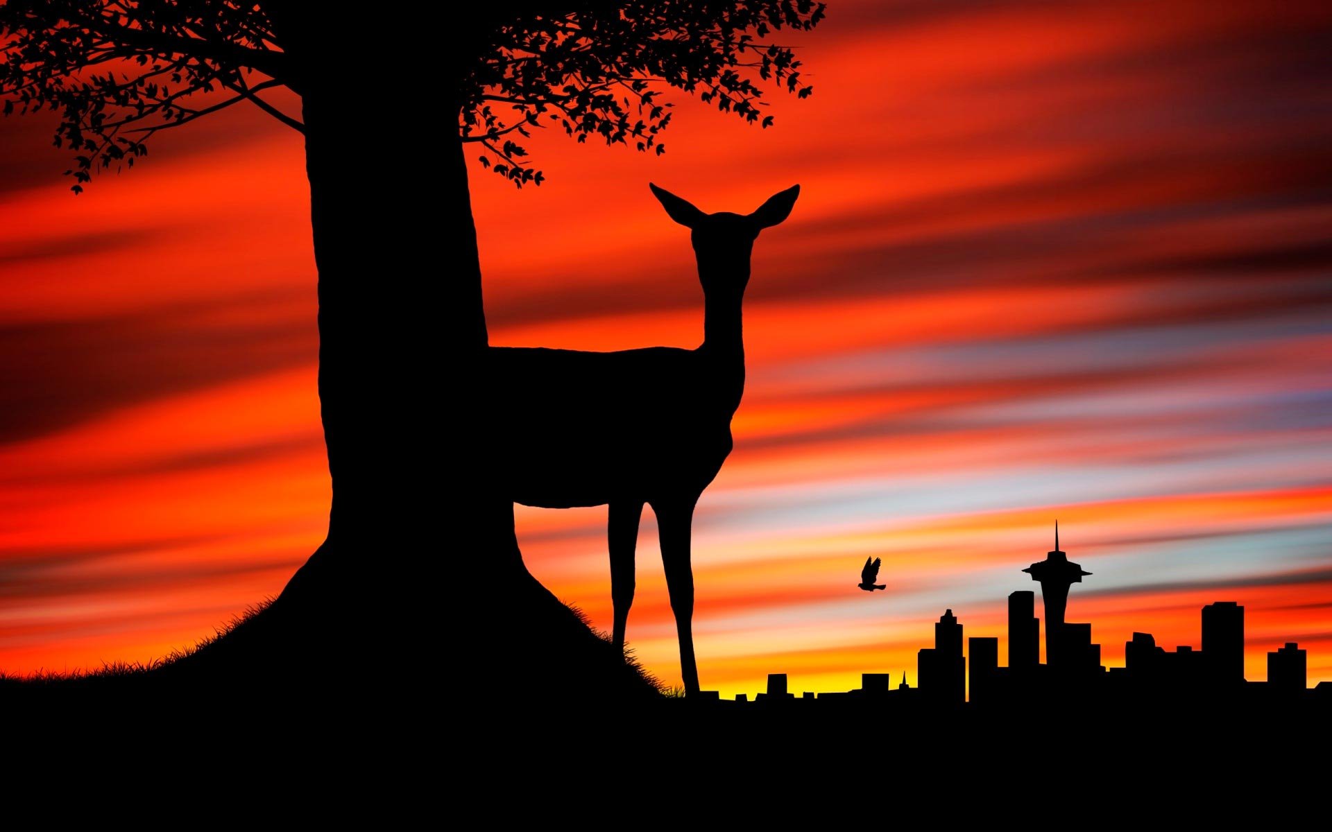 A serene silhouette of a deer stands near a tree against a vibrant sunset, with city skyline highlights, creating a striking HD desktop wallpaper.