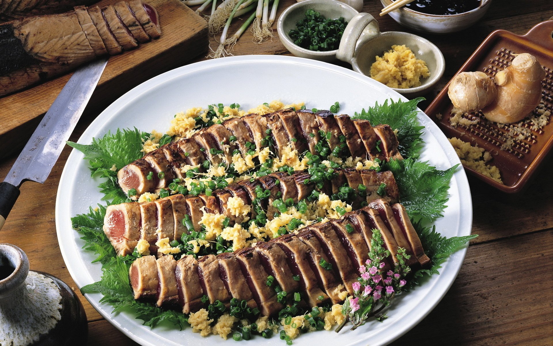 HD desktop wallpaper featuring a plated sliced fish dish garnished with herbs and accompanied by bowls of spices and mushrooms on a wooden table.