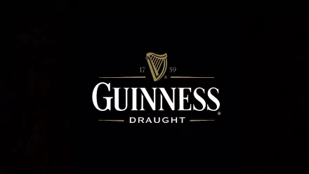 HD wallpaper featuring the iconic Guinness Draught logo against a black background, celebrating the rich heritage of this beloved beer brand.