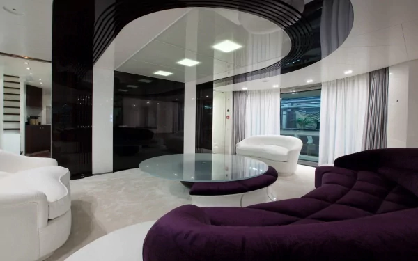 A modern, stylish room featuring sleek furniture in white and purple, large windows with sheer curtains, and a circular glass table, creating an inviting atmosphere for a HD desktop wallpaper.