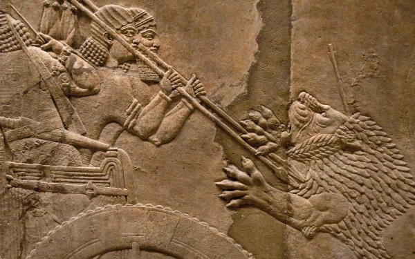 Artistic Assyria: lion hunts relief in high-detail stone, HD PC desktop wallpaper/background depicting a charioteer spearing a rearing lion.
