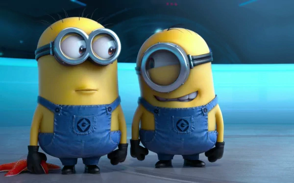 HD desktop wallpaper featuring Stuart and Bob from Minions in the movie Despicable Me 2. The cartoon characters are standing in a blue-themed background with their iconic denim overalls.