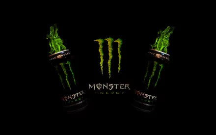 HD wallpaper featuring two Monster Energy cans against a black background, showcasing the brand's vibrant green logo and design.