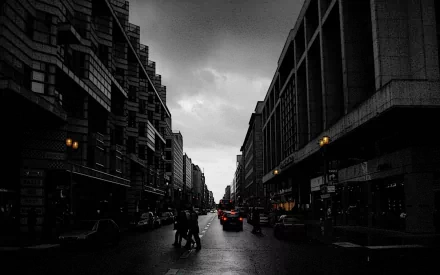 A moody black and white street scene in Berlin, featuring pedestrians and cars against a backdrop of modern architecture, creating a striking urban atmosphere.
