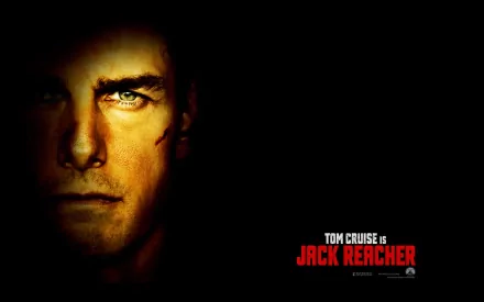 HD PC desktop wallpaper featuring a close-up of Tom Cruise as Jack Reacher, with intense lighting highlighting his face and the movie title in red text.