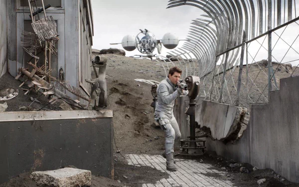 HD PC desktop wallpaper from the 2013 movie Oblivion featuring Tom Cruise in a futuristic, post-apocalyptic setting with debris and barbed wire fences.