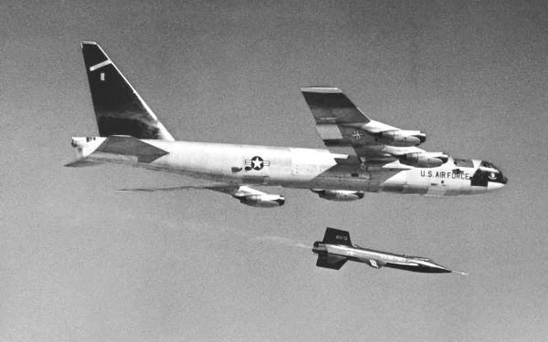 North American X-15 under a Boeing B-52 Stratofortress in flight — military test aircraft scene, 4K Ultra HD PC desktop wallpaper/background.