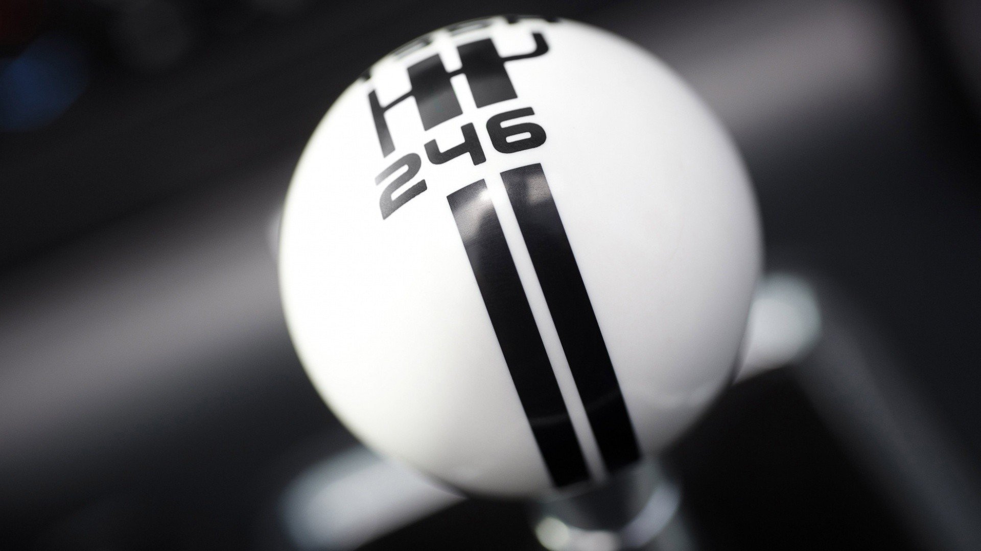 Close-up of a Ford Mustang Shelby GT500 gear shift knob featuring a white ball with black racing stripes and shift pattern, displayed as an HD PC desktop wallpaper.