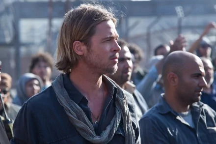 HD PC desktop wallpaper featuring a scene from the movie World War Z, showing a focused Brad Pitt amidst a crowd.