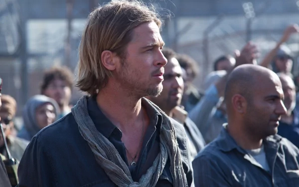HD PC desktop wallpaper featuring a scene from the movie World War Z, showing a focused Brad Pitt amidst a crowd.