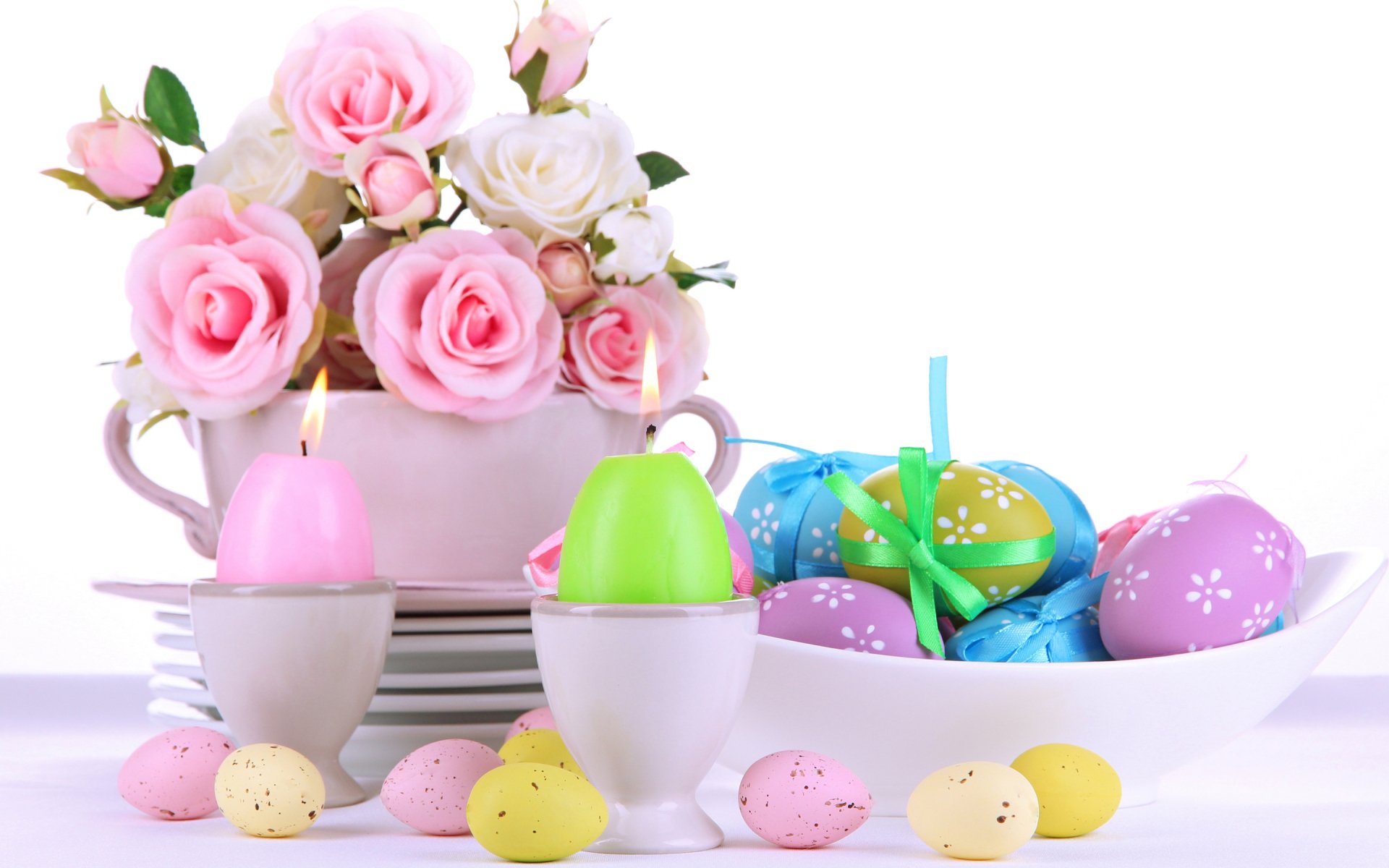 A vibrant Easter-themed HD wallpaper featuring colorful eggs, soft pink roses, and decorative candles, capturing the festive spirit of the holiday beautifully.
