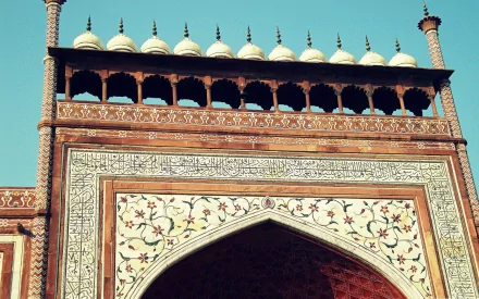 Intricate architectural details of the Taj Mahal, showcasing its ornate design and craftsmanship. A stunning HD desktop wallpaper highlighting this iconic man-made marvel.