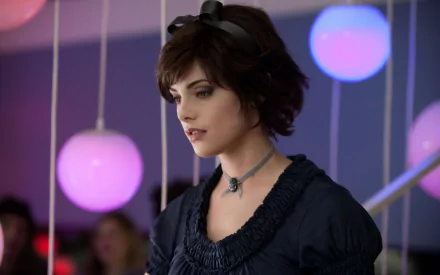 A scene from *The Twilight Saga: Eclipse*, featuring a character in a stylish outfit, set against a backdrop of colorful hanging lights, creating a captivating atmosphere.