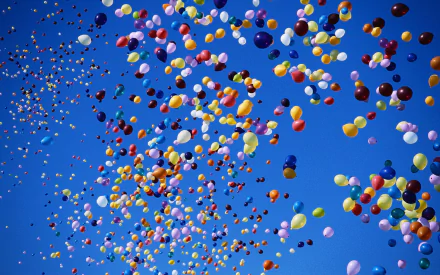 A vibrant display of colorful balloons floats against a clear blue sky, captured in stunning detail. This HD photograph serves as an engaging desktop wallpaper and background.