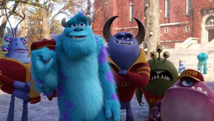 HD wallpaper featuring James P. Sullivan and friends from the movie Monsters University standing outdoors on a college campus.