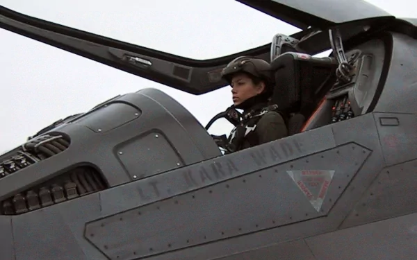 HD PC desktop wallpaper from the movie Stealth featuring a pilot seated inside a stealth fighter jet cockpit.