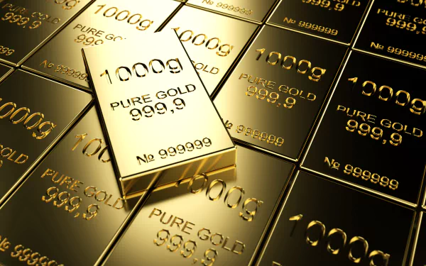 A collection of gleaming gold bars, highlighting the intricate details etched on each piece, creates a luxurious and visually captivating HD desktop wallpaper.